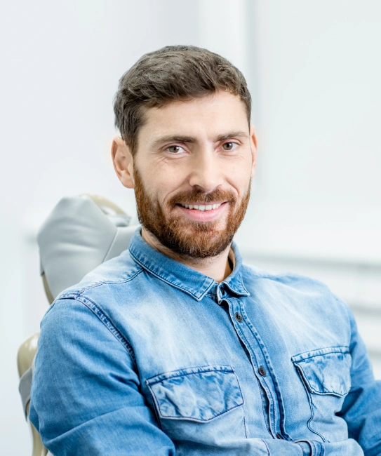 Relaxed and confident male patient smiling after comfortable oral sedation dentistry experience